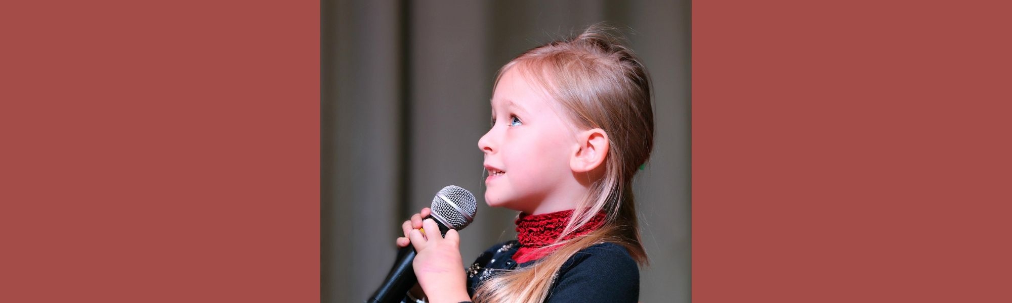 Little girl holding microphone