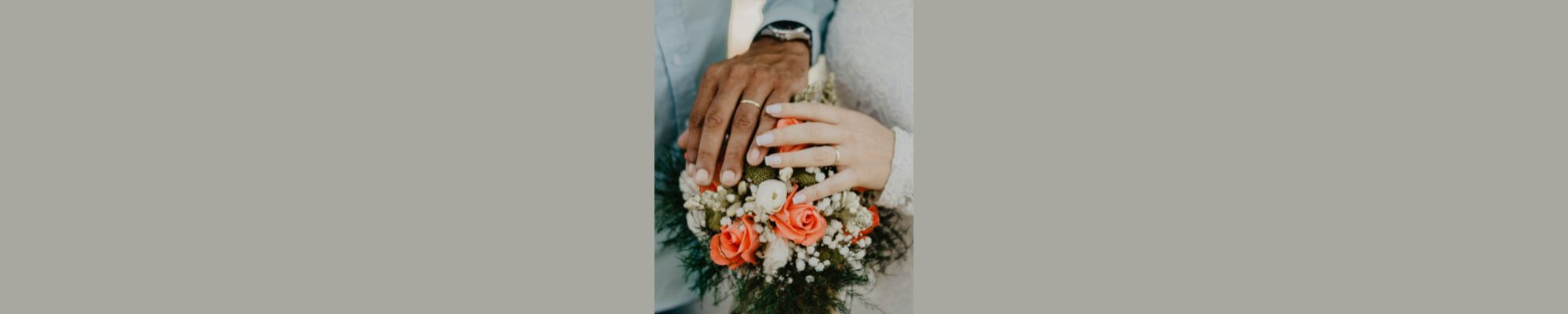 Hands of couple with their wedding rings
