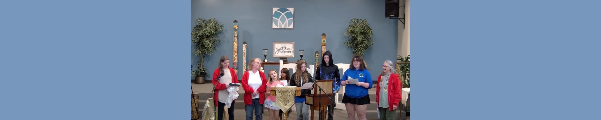 Kids and teachers singing in sanctuary