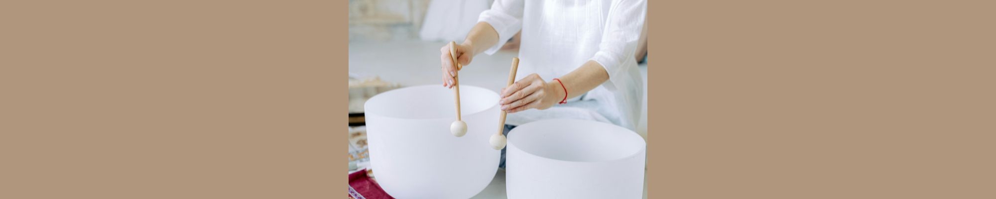 Person playing singing bowls
