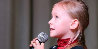 Little girl holding microphone