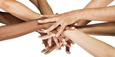 Hands joining together