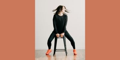 Person on stool doing yoga stretch