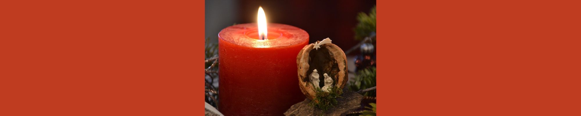 Candle and nativity scene